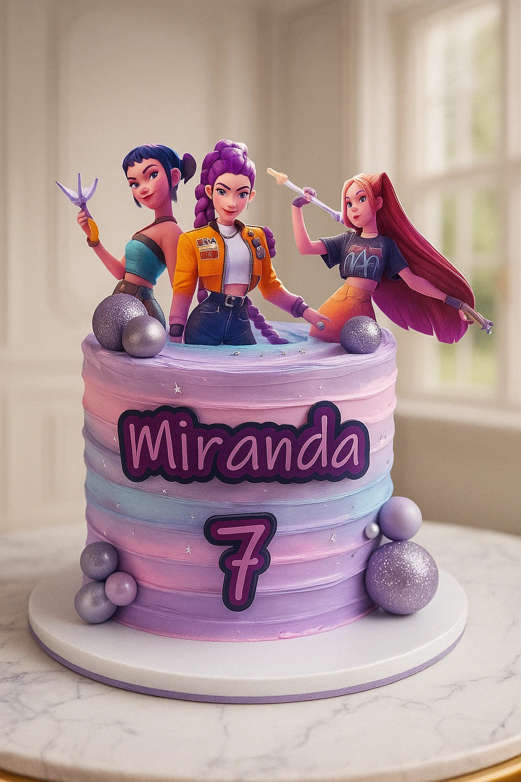 Birthday cake with three animated character figurines on top, featuring the name 'Miranda' and the number '7'.